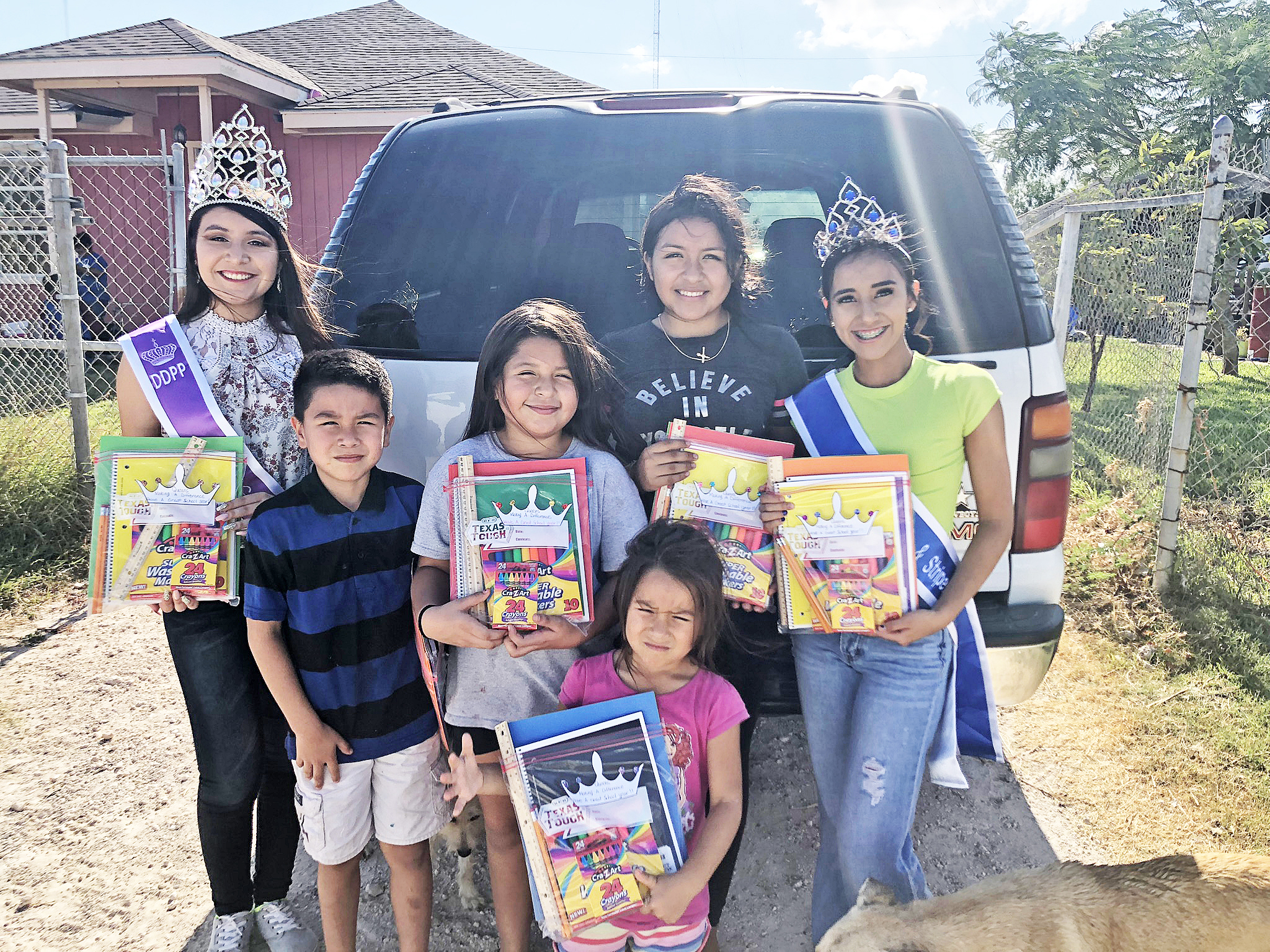 Mercedes beauty queens hand out schools supplies